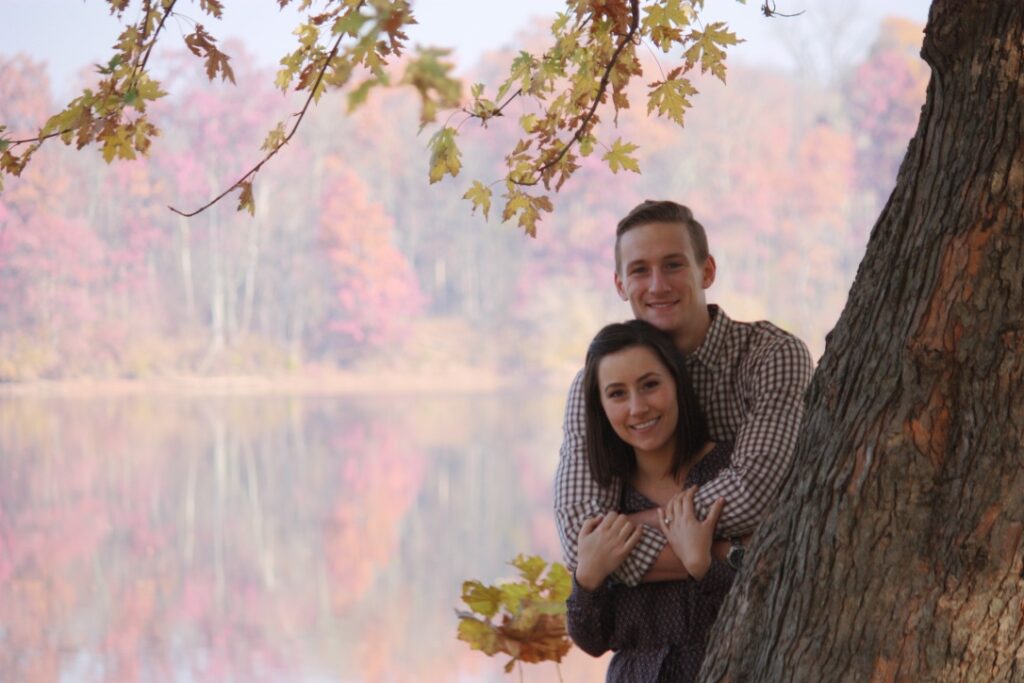 Couple sitting River Side, under a tree