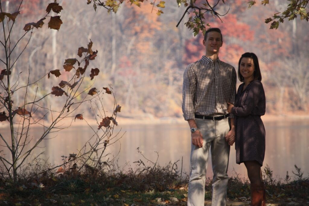 Couple sitting River Side, under a tree