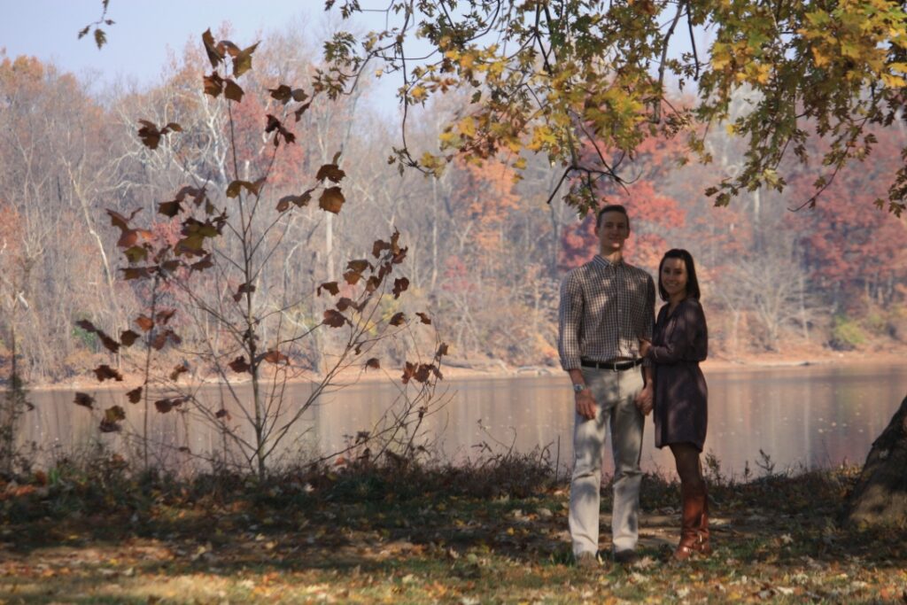 Couple sitting River Side, under a tree