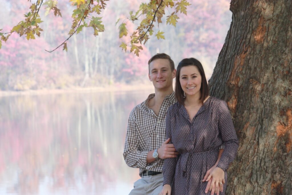 Couple sitting River Side, under a tree