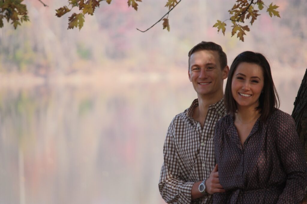 Couple sitting River Side, under a tree