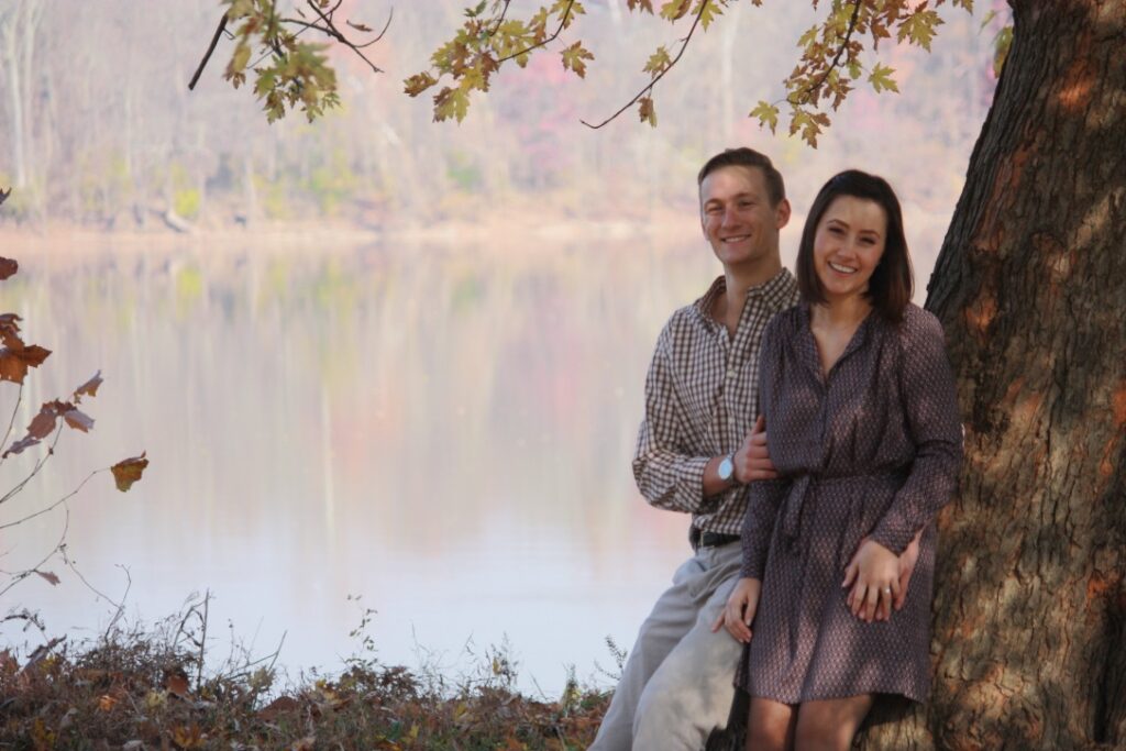 Couple sitting River Side, under a tree