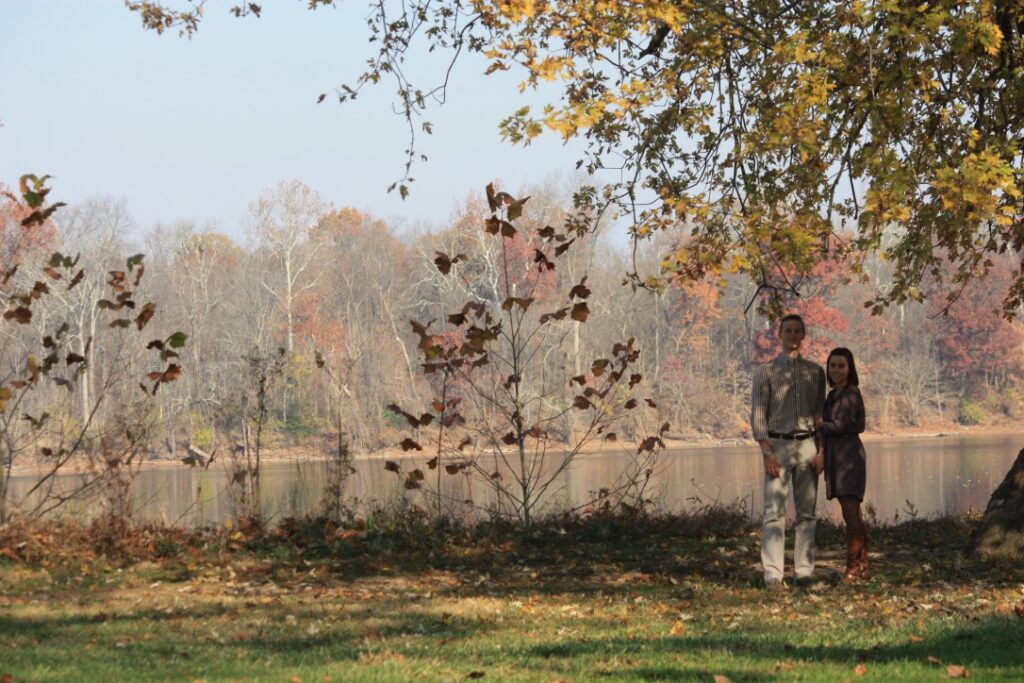 Couple sitting River Side, under a tree